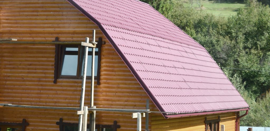 House with a roof made of solid metal sheets, shaped like an old tile